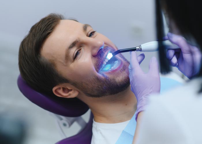 man during a dental filling appointment 